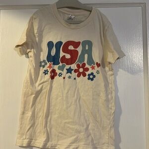 The cutest cream USA shirt with floral and hear details size small 6-8